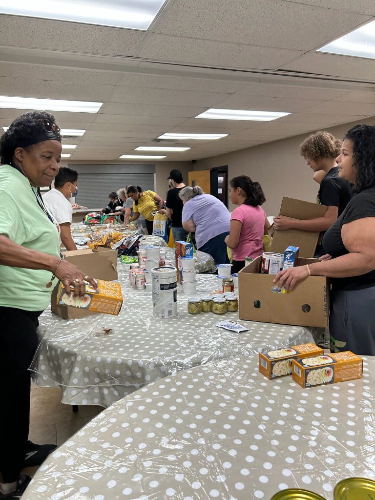 Volunteers packing food at Sowing 4 Jesus pantry